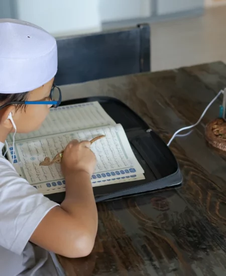 asian-kid-reading-al-quran-through-video-call-duri-2023-11-27-05-16-12-utc